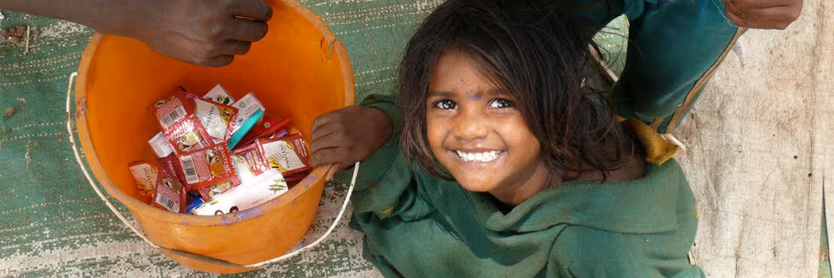 Young Street Child With Donations.