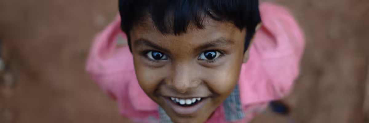 Boy Looking Up And Smiling.
