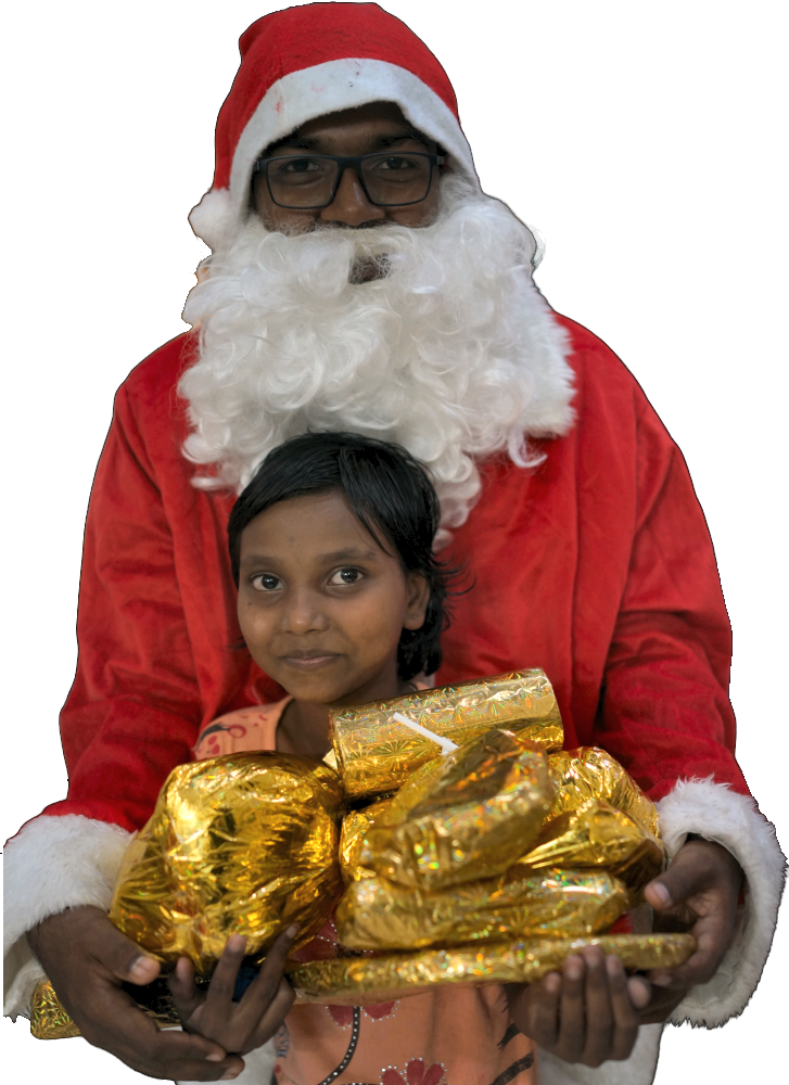 Father Christmas giving out presents at Coa Outreach